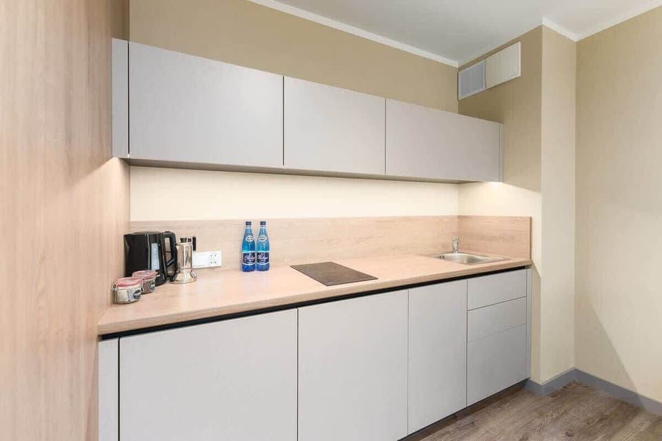 The fully equipped kitchenette includes everything you need for a home-cooked meal.