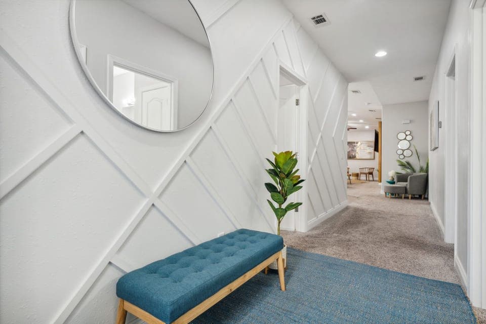 Welcome to Sandy Bliss! You are instantly wowed by this decorative wall.