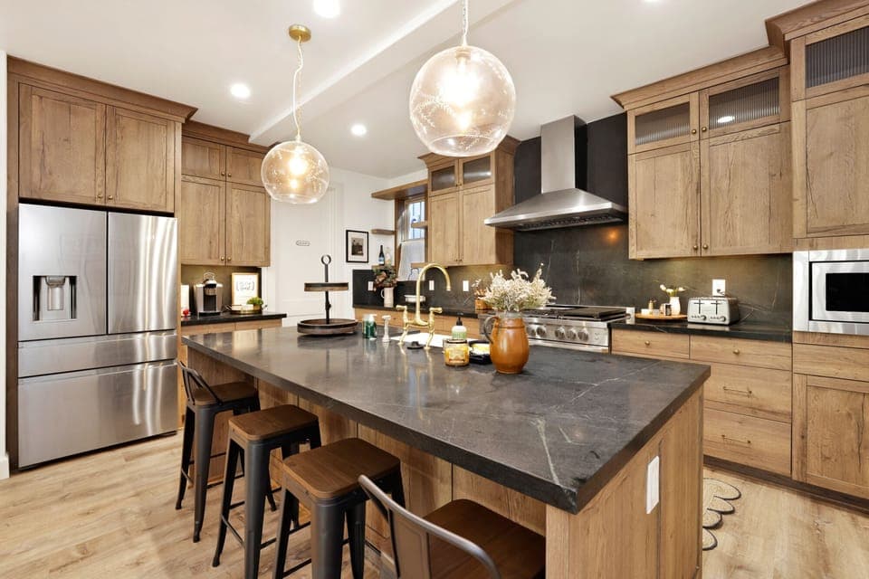 Fully equipped cabin kitchen with ample cabinetry, stove, microwave,  fridge, and coffee maker—perfect for cooking meals, morning coffee, and feeling right at home on your stay.