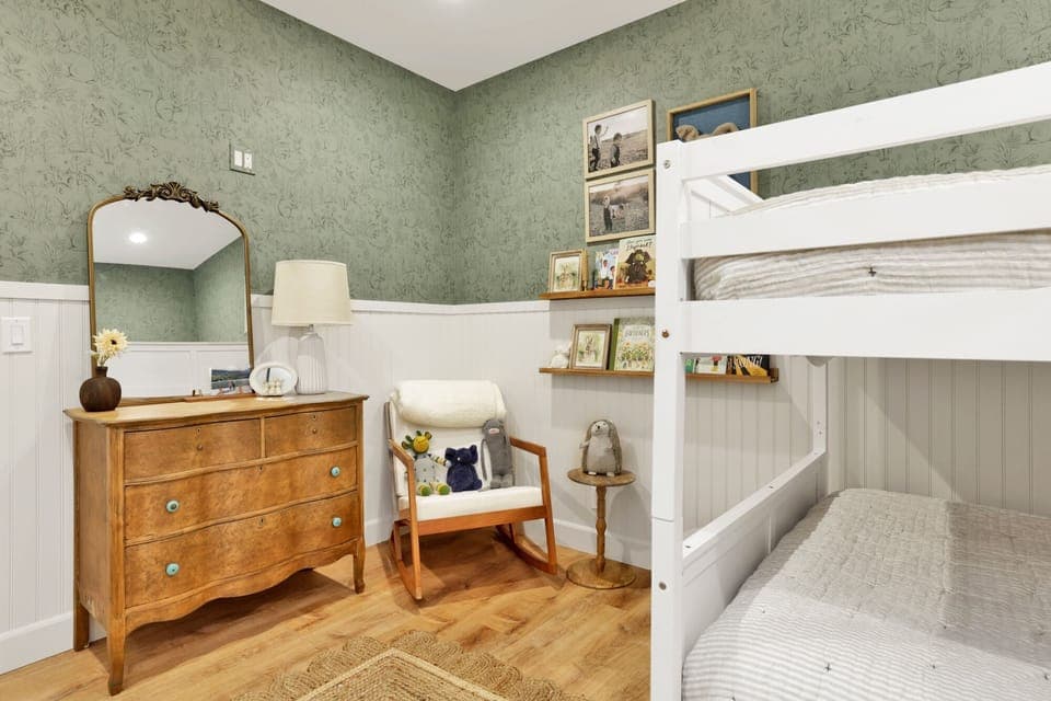 Peaceful cabin bedroom with plush bedding, and beautiful views—ideal for restful nights, cozy mornings, and a relaxing mountain escape.