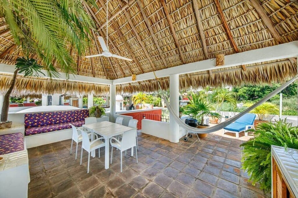 Your own palapa roof has seating areas, dining areas, a counter for food preparation, lounge 
