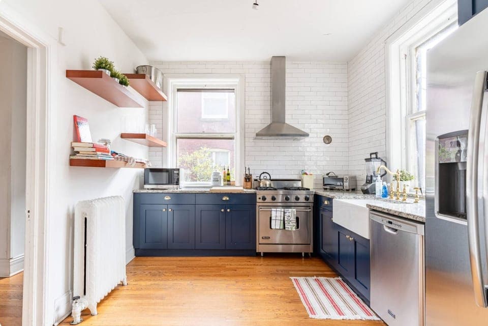 Full-service kitchen, equipped with Viking range and top appliances.