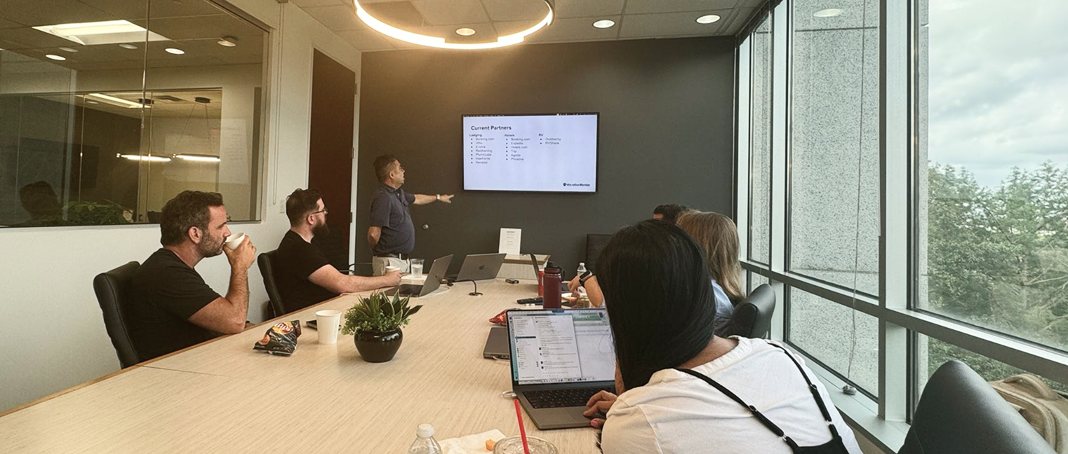 People in meeting room around a table